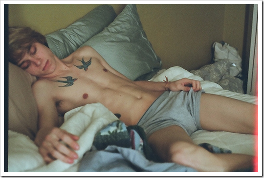 hot, skinny, blond boy sleeping in boxers with sparrow tattoos