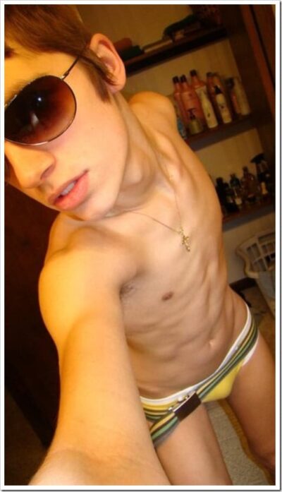 Skinny Twink Sporting Sunglasses & Bathing Suit