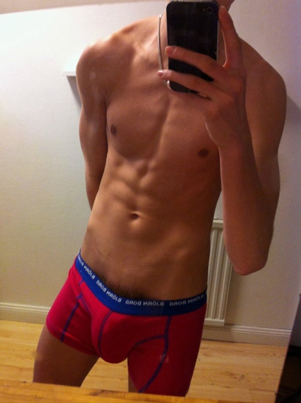 Lean & Toned Boy Bulging Out of Red Boxer Briefs