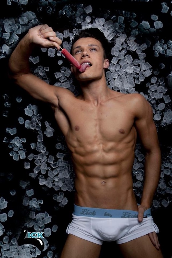 Hot boy licking a lollipop in his briefs