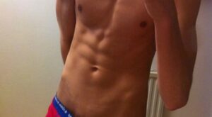 Lean & Toned Bulging Out of Red Boxer Briefs