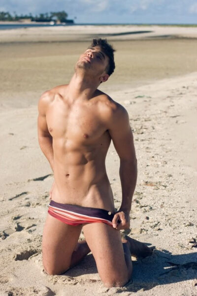 Pulling Down His Swim Briefs