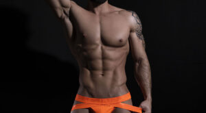 Hard Muscle in Neon Orange Jockstrap